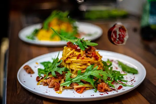 Arugula_Pomegranate_Spaghetti_Delightful_Pasta_Dish_Savory_Arugula_Flavor_Sweet_Pomegranate_Accent_Luscious_Sauce_Nutritious_Meal_Healthy_Dinner_Option_Aromatic_Dish_Italian_Cuisine_Satisfying_Bite_Wholesome_Cooking_Homemade_Ayurvedic_Cuisine_Pasta_Lovers_Treat_Ayurvedic_Food_Ayurveda